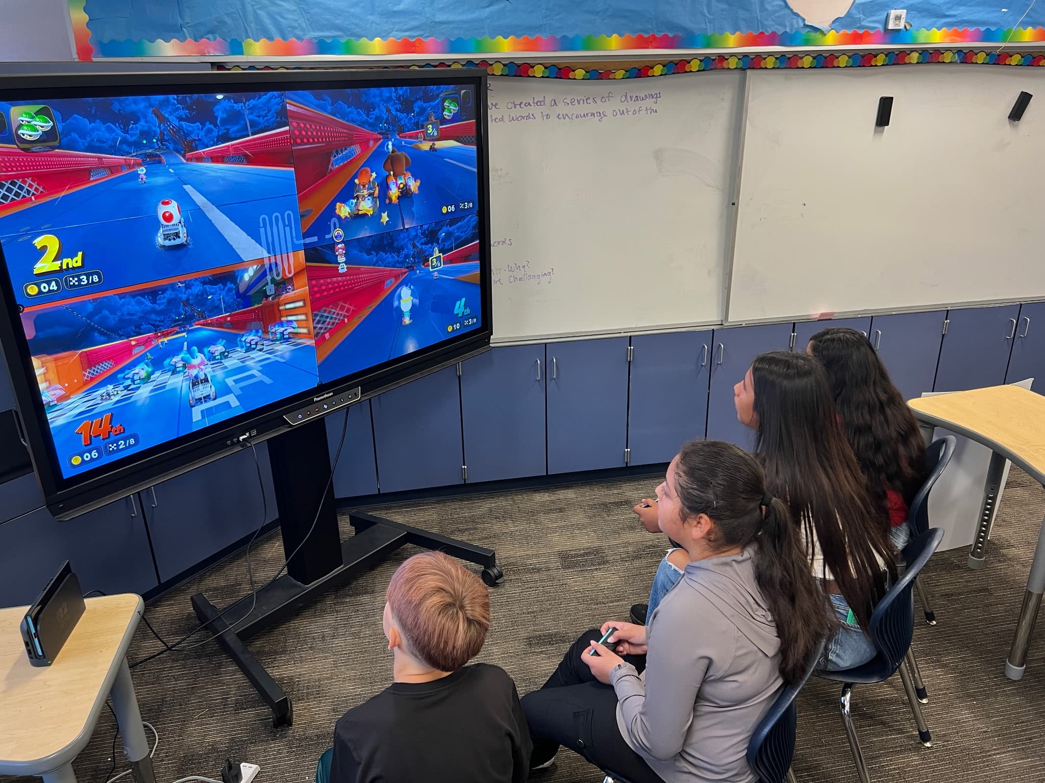 Students playing a multiplayer racing game during an esports program.