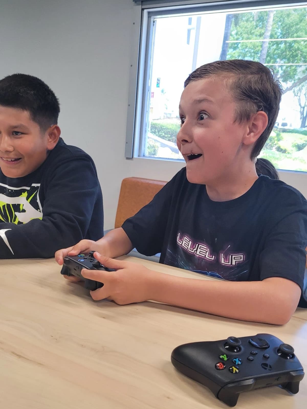 Two students playing a video game during an iAttend Esports program.